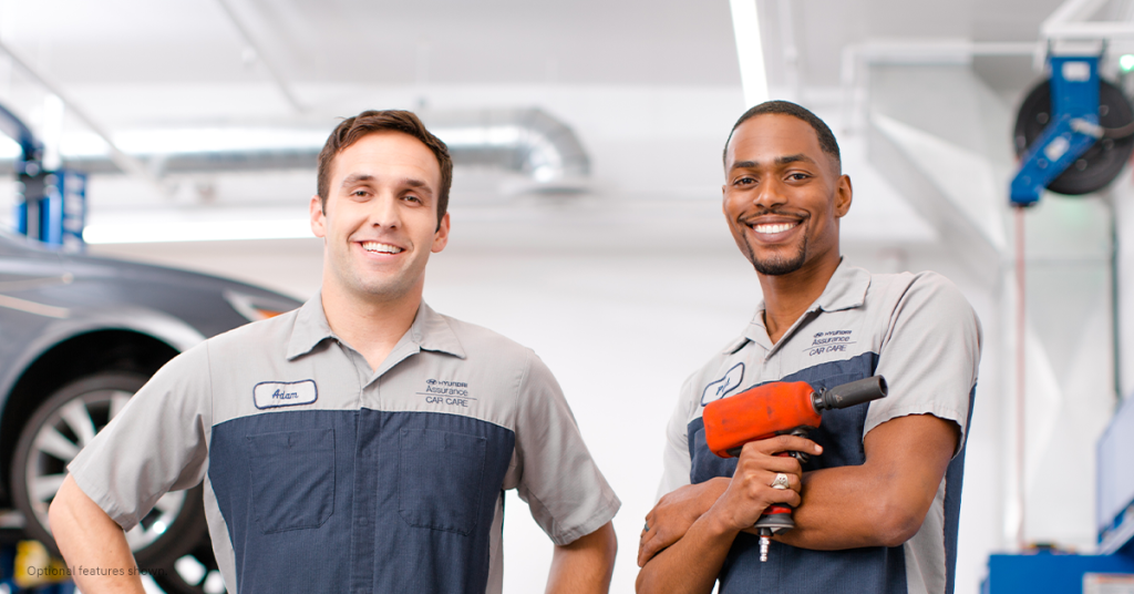 Two smiling service techs