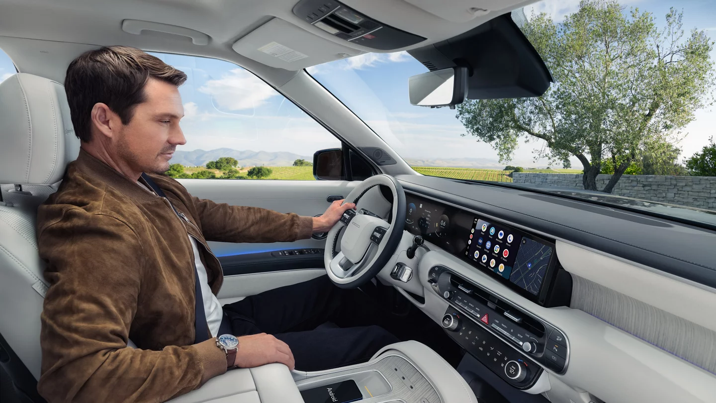 Man driving a Hyundai and using driver assistance safety features